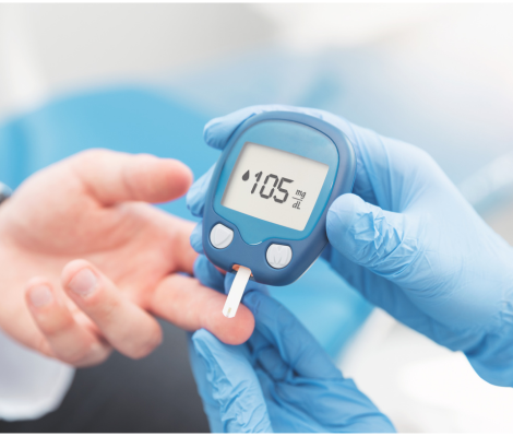 a nurse testing someone's blood sugar level